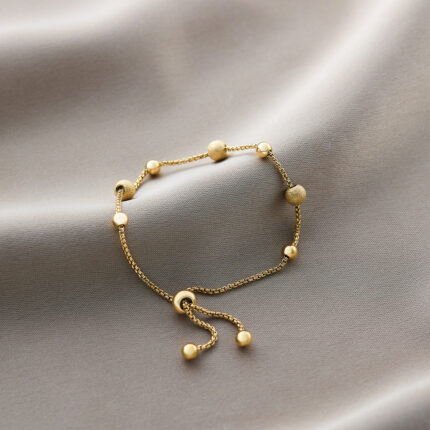 Frosted beads draw gold