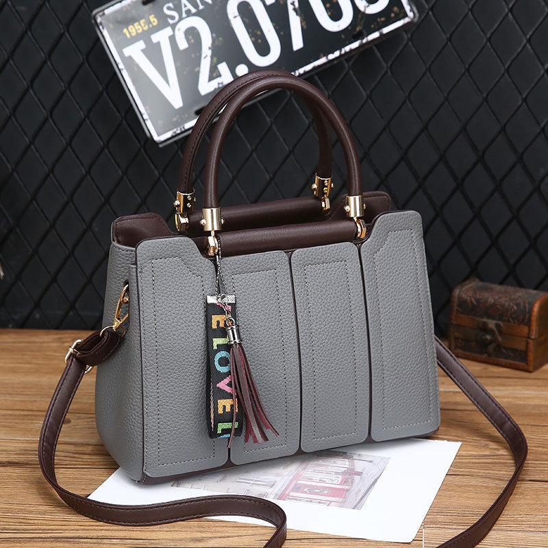 O1CN018KEQWF1O9FLk9t0Hi_2219507531662-0-cib.jpg European & American Style Large-Capacity Commuter Tote Fashionable Solid Color Spliced Shoulder & Handbag - Image 1