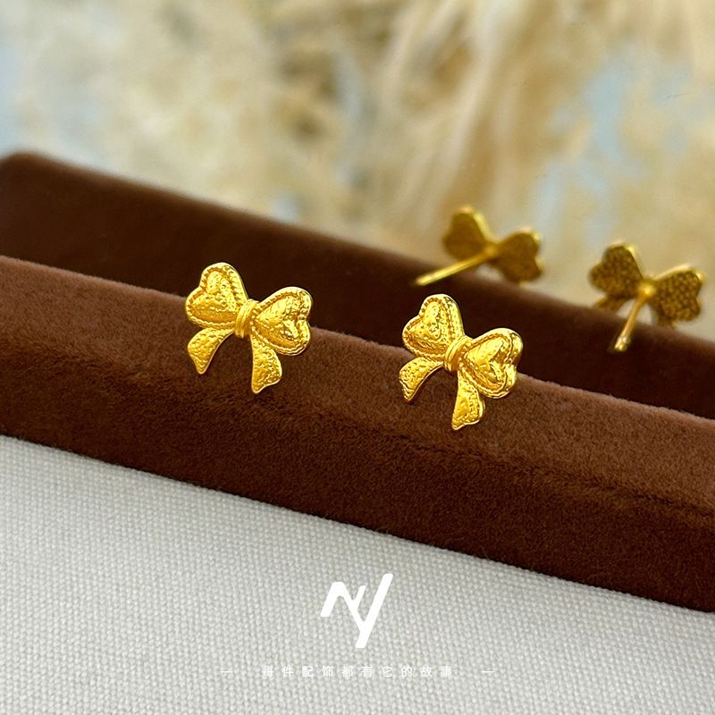 O1CN01LGAJbk1DQEHRD7KdM_2140130210-0-cib-1.jpg Sha Jin Fugitive Princess Bow Stud Earrings INS Style High Aesthetic Gold Bow Imitation Gift Earrings Wholesale - Image 1